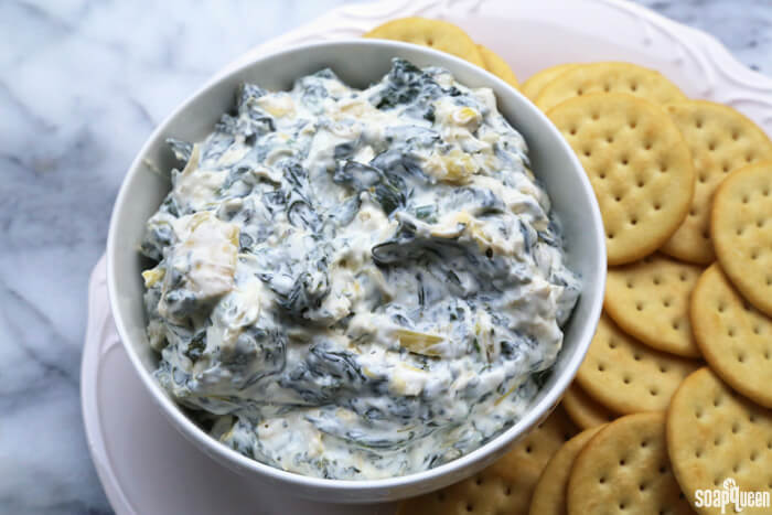Made with fresh spinach, light Greek yogurt and light cream cheese, this Spinach and Artichoke Dip is always a hit at parties and gatherings!