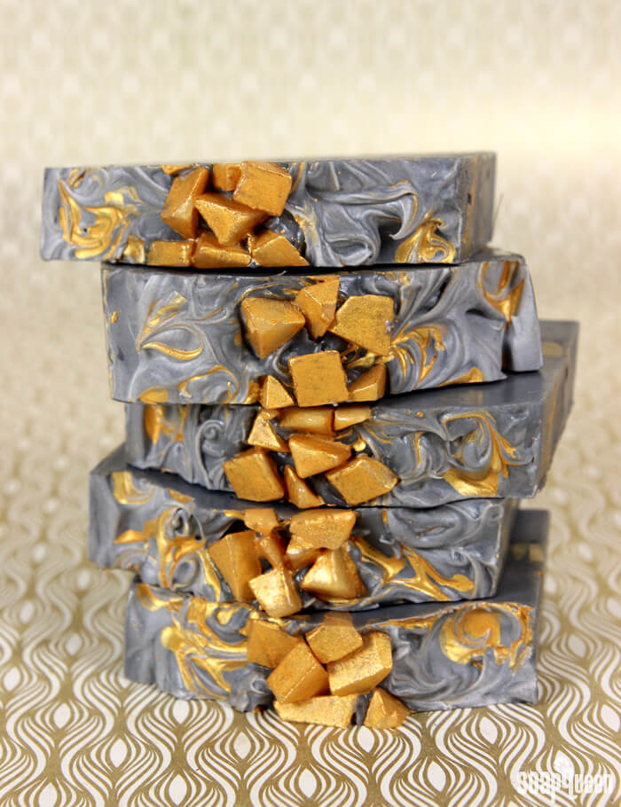 This Gold Mine Cold Process Soap is made with activated charcoal and gold mica to create stunning contrast. Learn how to make it in this blog post!