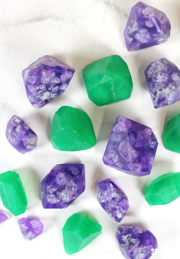 Learn how to make soap gems in this easy video tutorial! Post includes two different techniques to make soap emeralds and amethysts.