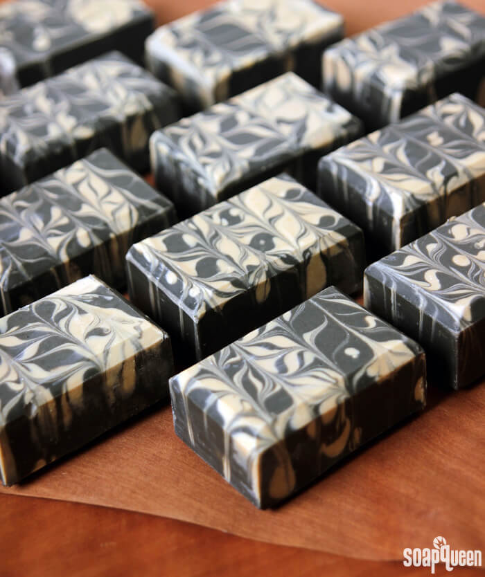Learn how to make this Charcoal & Cedar Beer Cold Process Soap. It's scented with a natural blend of essential oils, and uses all natural colorants to create a beautiful contrasting swirl.
