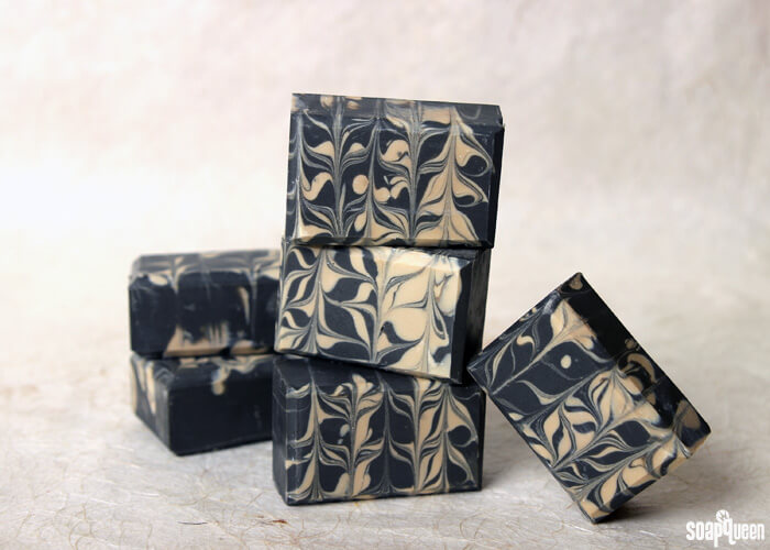Learn how to make this Charcoal & Cedar Beer Cold Process Soap. It's scented with a natural blend of essential oils, and uses all natural colorants to create a beautiful contrasting swirl.