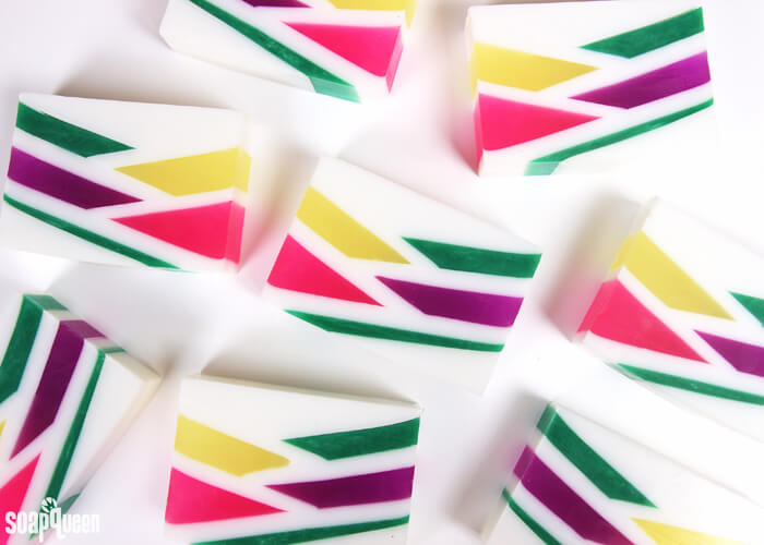 This Neon Geometric Melt and Pour Soap uses bright colors and layers to create a fun retro inspired design. Learn how to make it in this step by step tutorial!