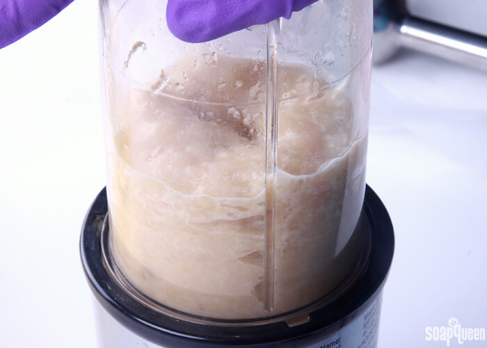 Blending the kombucha and SCOBY together to create a puree. This puree is added to the soap at trace.