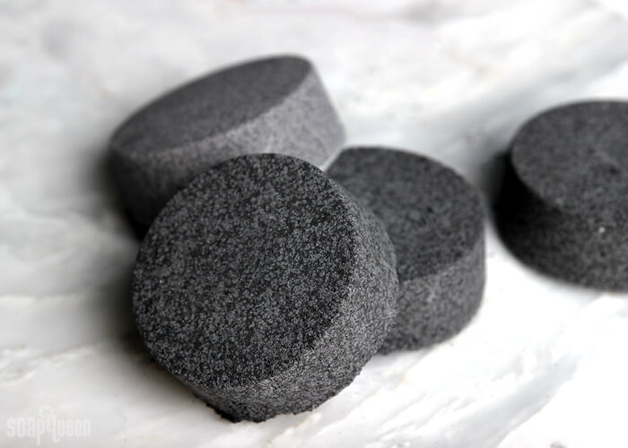 Black Bath Bombs: A Cautionary Tale // Black bath bombs have gone viral, but do they work? Several black bath bomb recipes are put to the test, including black bath bombs made with charcoal.
