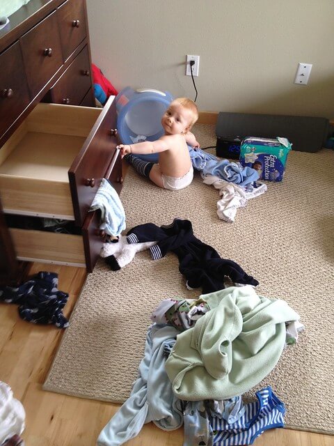 Jamisen playing in drawers.