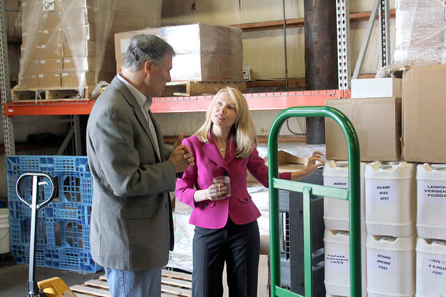 Anne-Marie and Jay Inslee in the warehouse. Anne-MarieandJay.warehouse