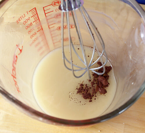 Adding cocoa powder to the rest of the batch.
