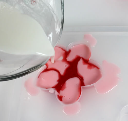 Pouring white soap with the Aloha Soap Kit.