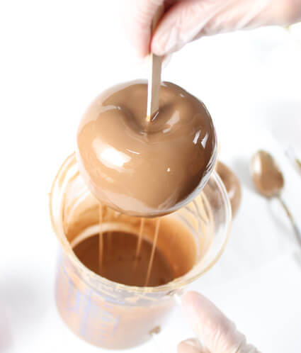Dipping our soap apples in caramel-coloured soap