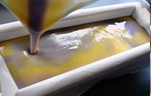 Pouring the soap into the mold for an In The Pot Swirl.