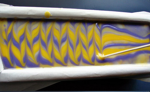 Swirling the top of the yellow, purple and white In The Pot Swirl.