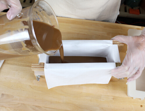 Pouring the brown soap.