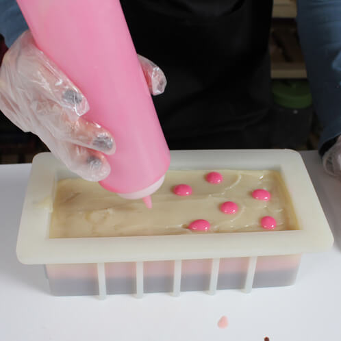 Pink dots on top of the white layer.