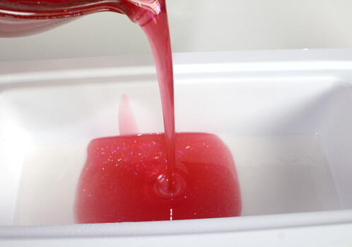 Red and white peppermint soap production.