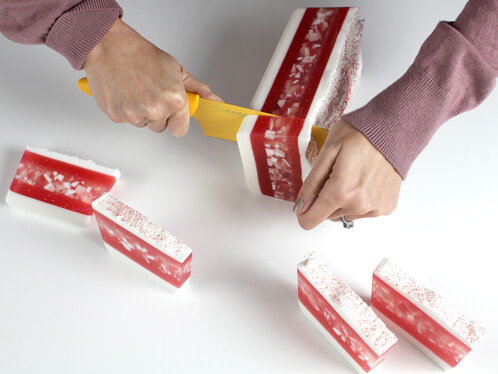 Pepperminty soap being cut.