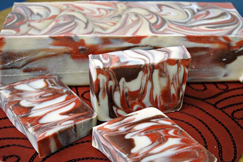 Red, black and white swirled soap loaf.
