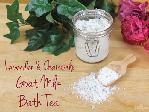 Glass bail jar holding muslin bath tea sachets filled with epsom salt, lavender buds and oatmeal on a linen cloth