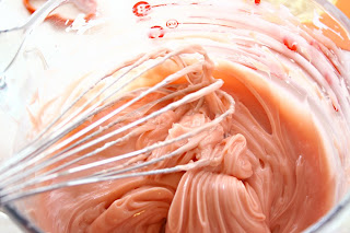 Mixing soap batter with a whisk to a frosting consistency
