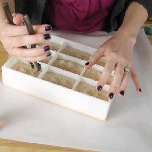 Removing dividers from a wood slab mold